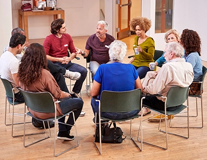 Small group of people meeting to discuss a Bible lesson.